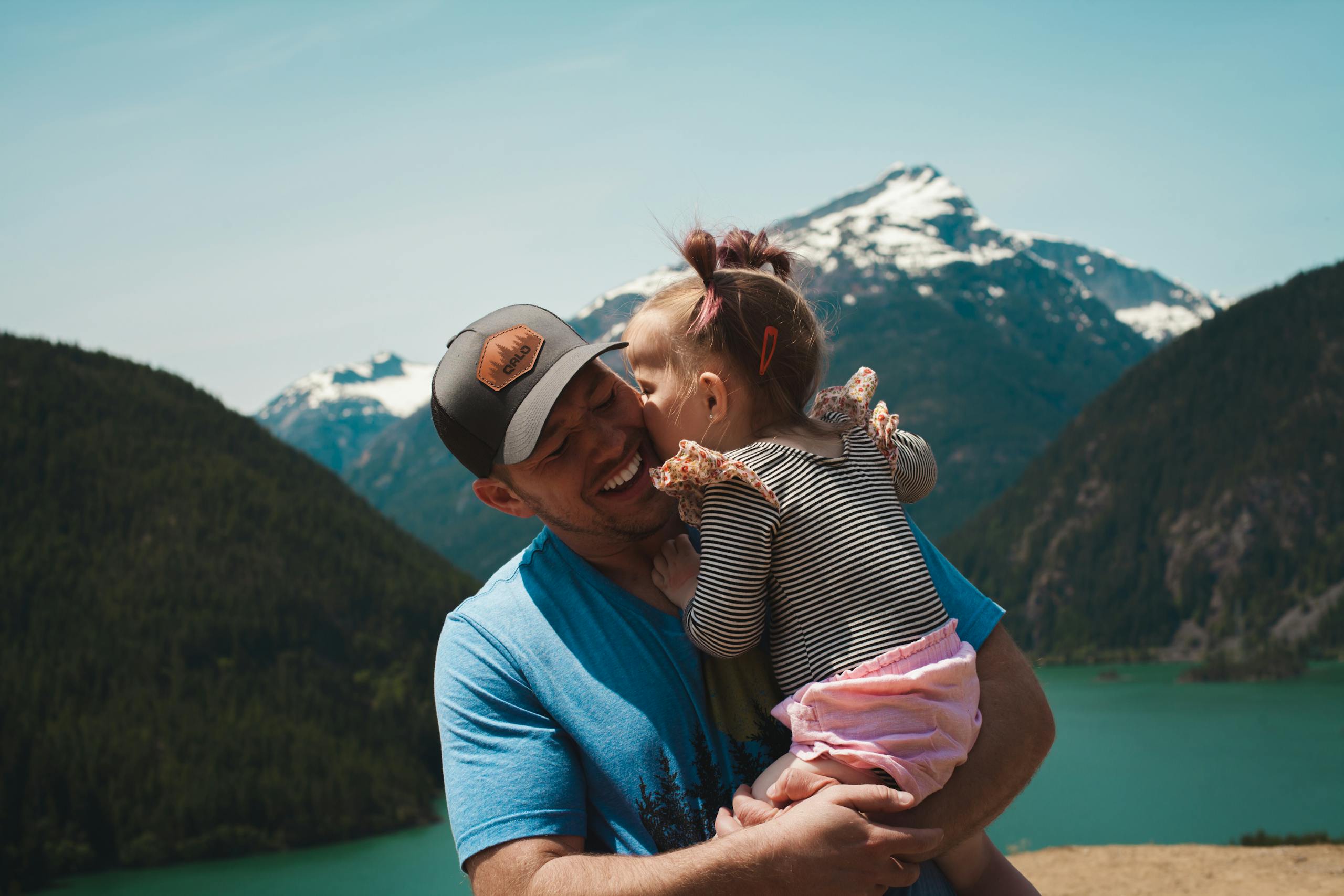 A Little Girl Giving her Dad a Kiss