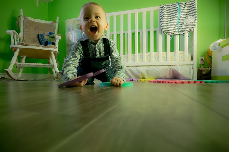 Full Length of Boy Sitting on Floor