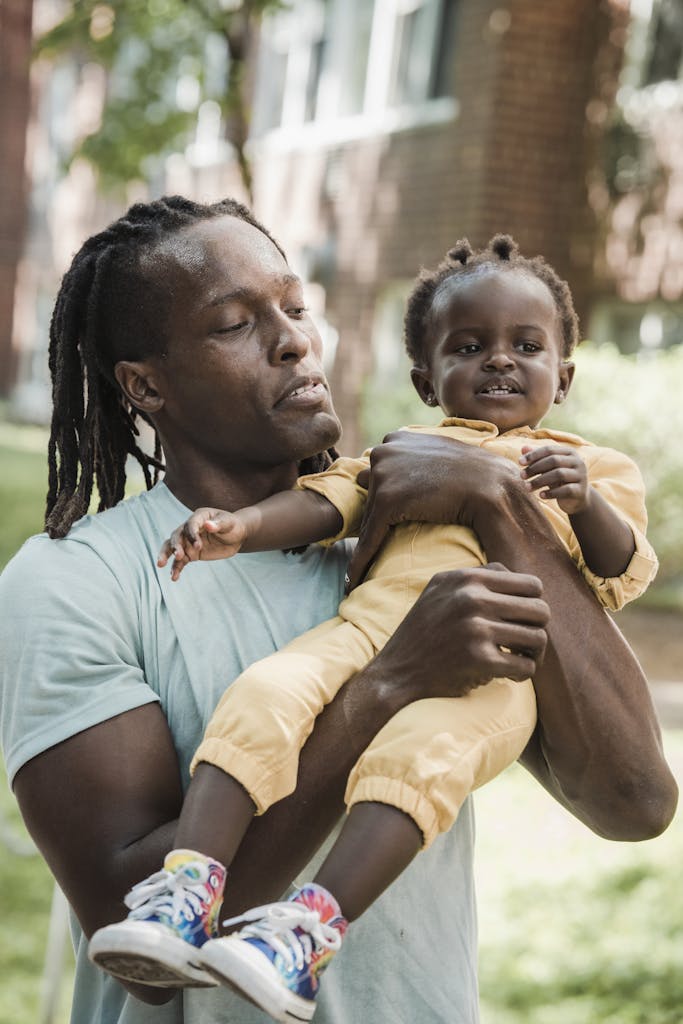 A Father Carrying Her Daughter