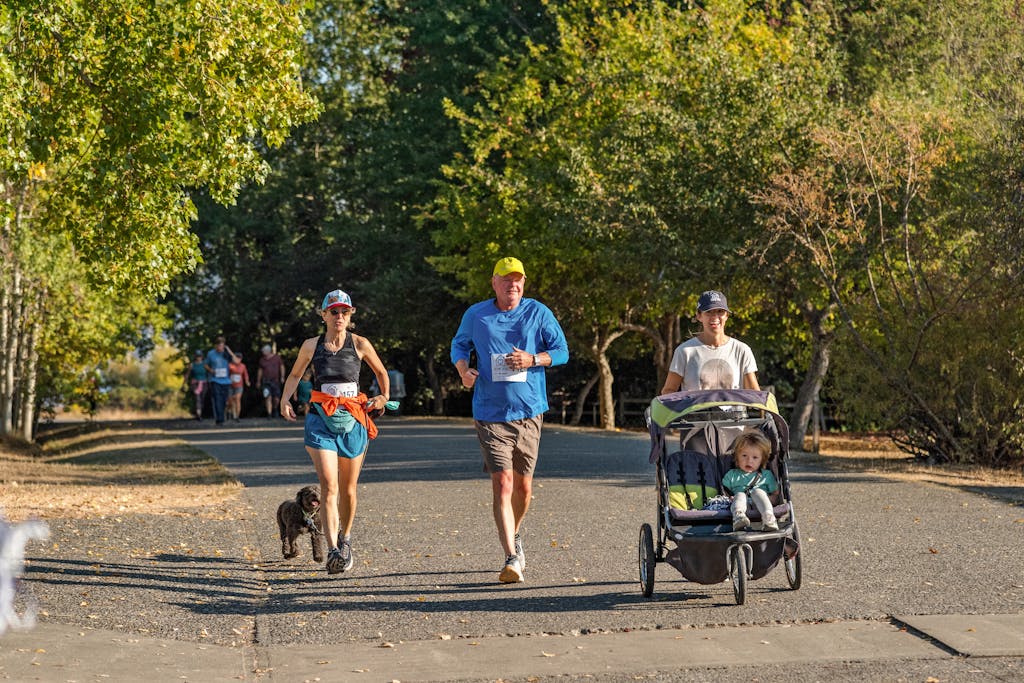 Group of People Running on the Street