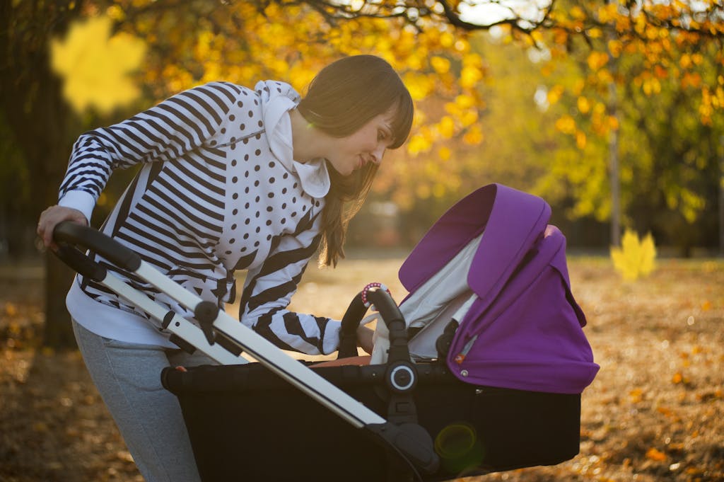 Photo of a Woman Looking Her Baby