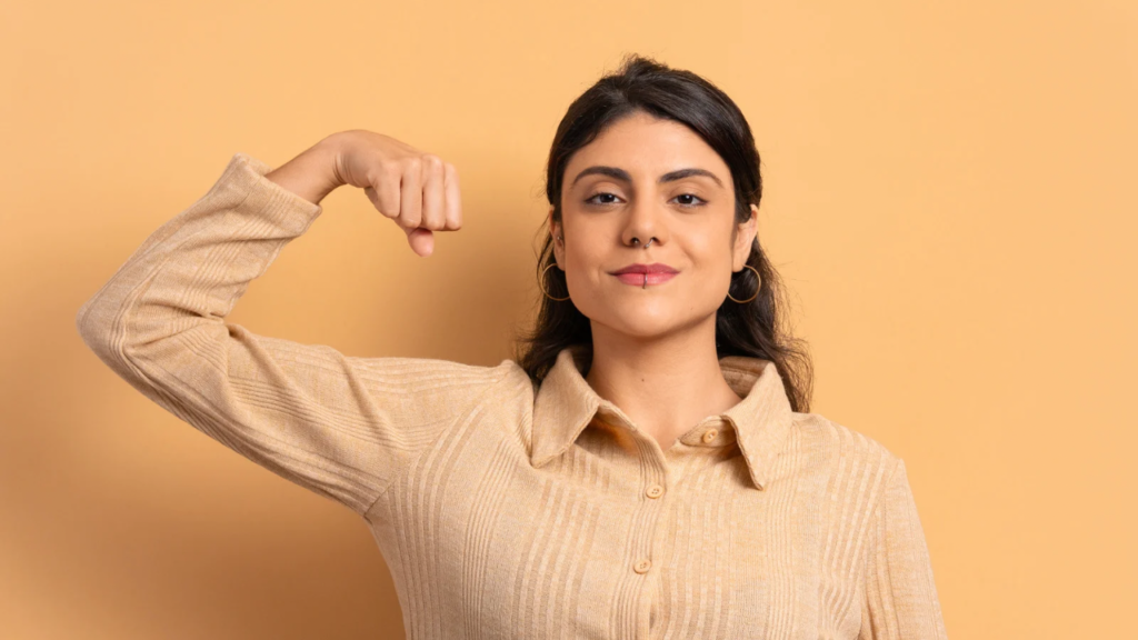 a proud woman flexing